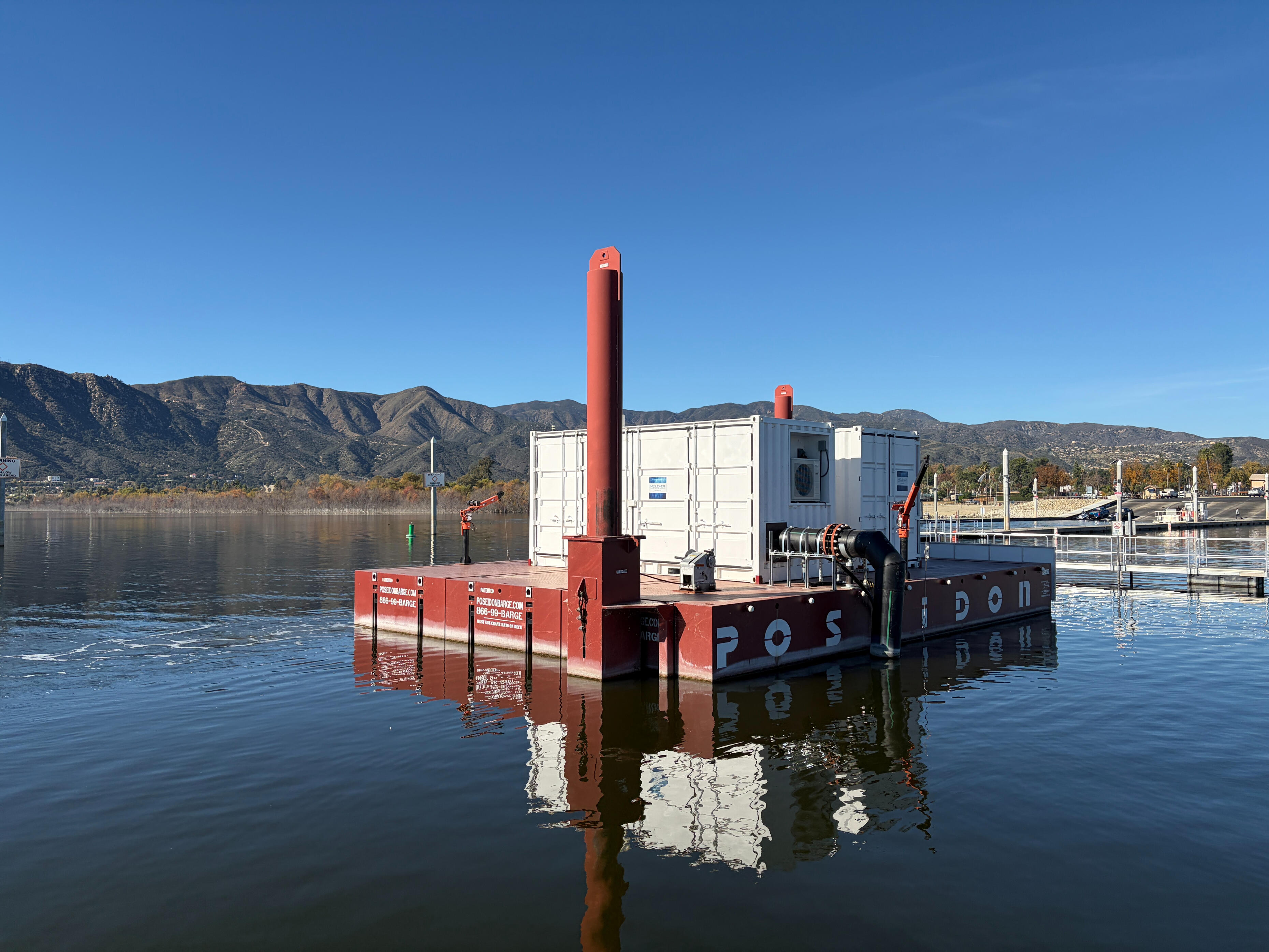 Nanobubble generator installed on floating barge used for lake or reservoir water treatment
